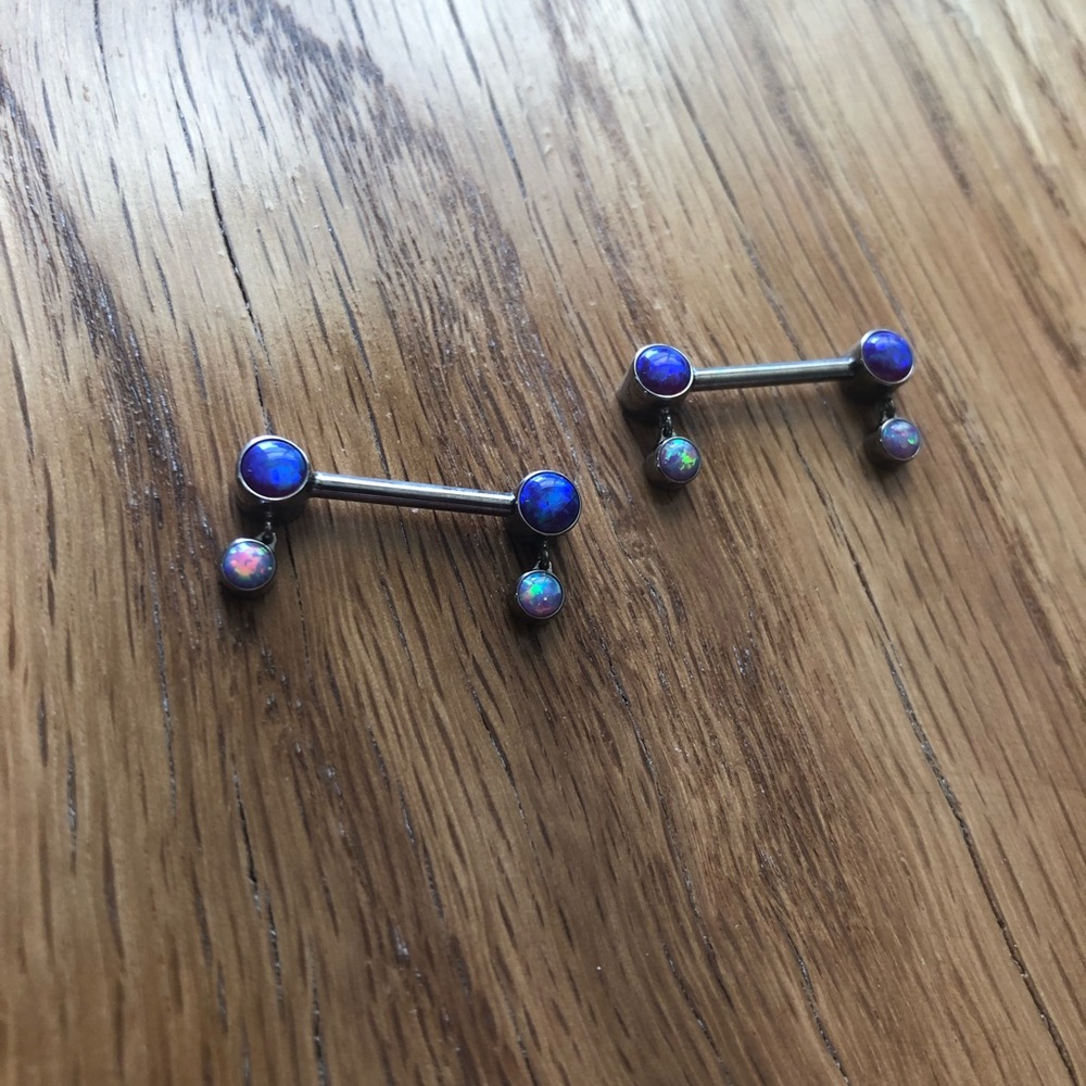 Purple and light purple opal nipple rings. Unworn. 14g